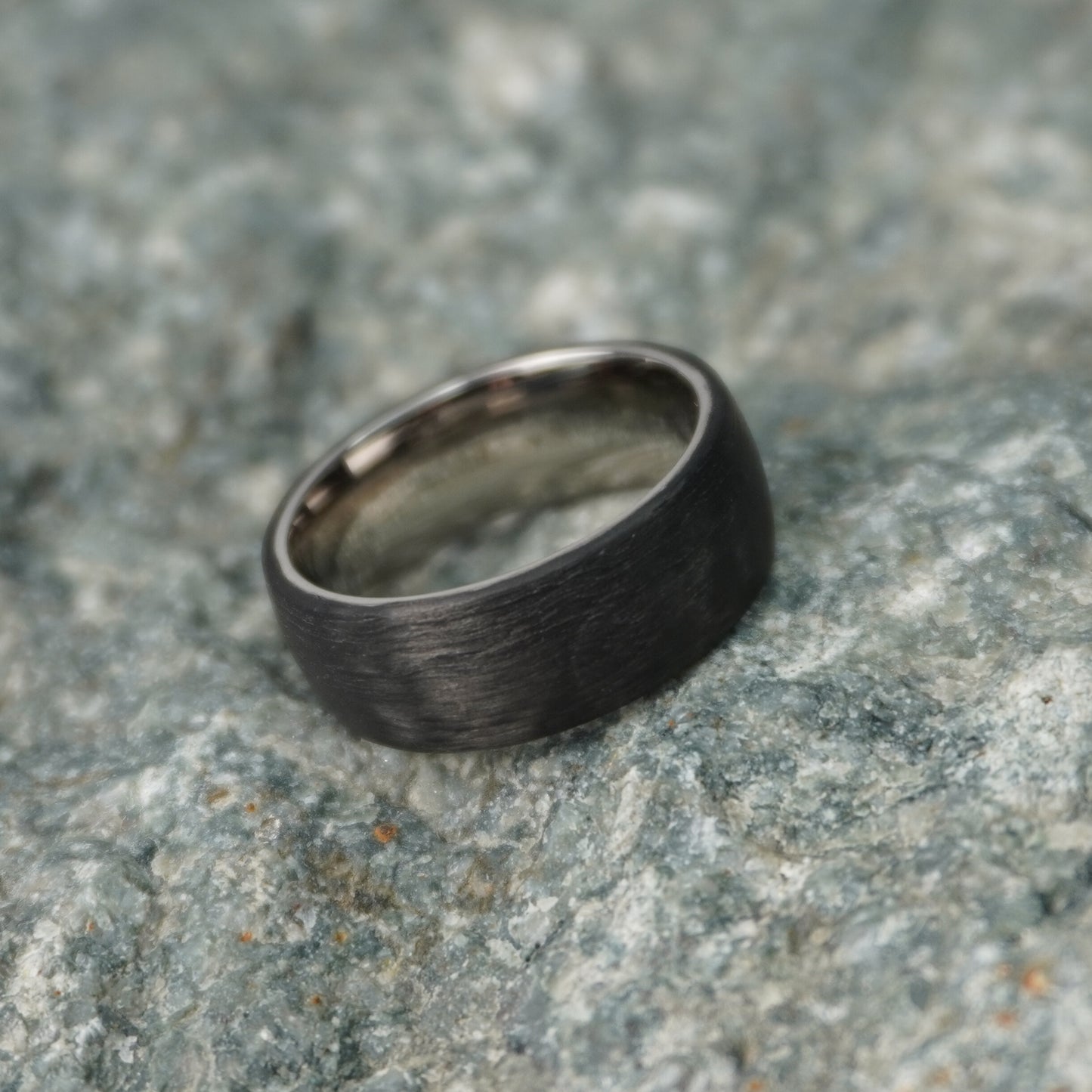 Aerospace grade carbon fiber ring in matte black finish by Forge and Lumber, 8mm width, available in multiple sizes.