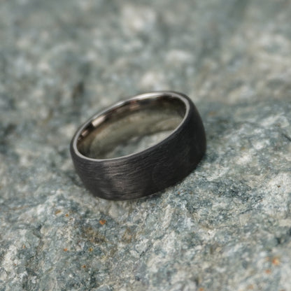 Aerospace grade carbon fiber ring in matte black finish by Forge and Lumber, 8mm width, available in multiple sizes.