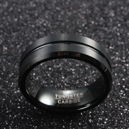 Black beveled tungsten carbide ring by Forge and Lumber, featuring an 8mm width, available in sizes UK M to O.