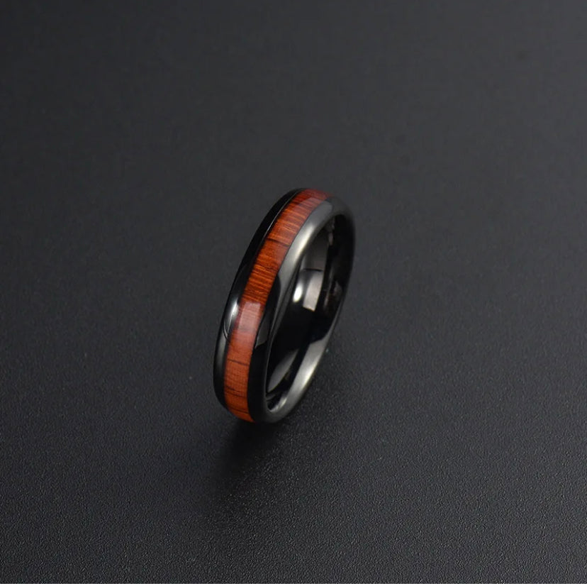 Black durable ring with a 4mm Hawaiian wood inlay by Forge and Lumber. Available in sizes UK I to K.