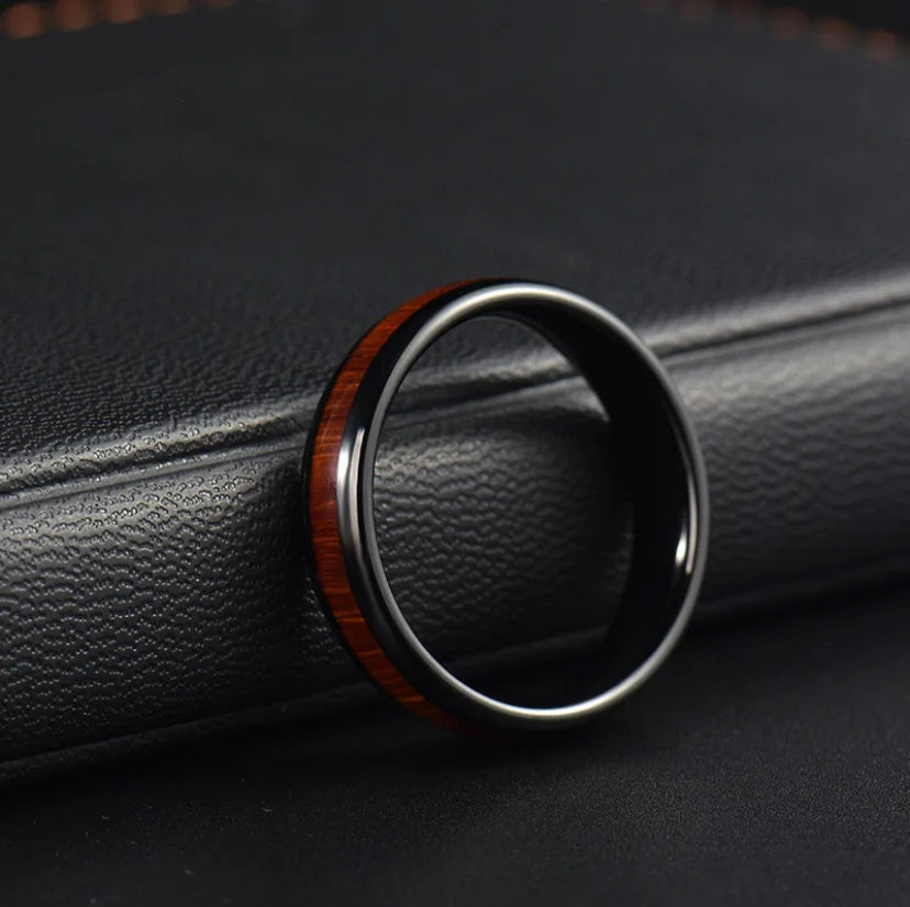 Black and wood grain ring by Forge and Lumber, 4mm, durable design, suitable for anniversaries.