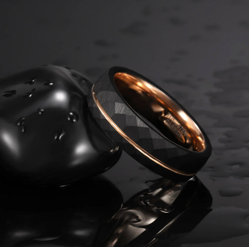 Black 6mm men's ring with a faceted design and rose gold inner band by Forge and Lumber.