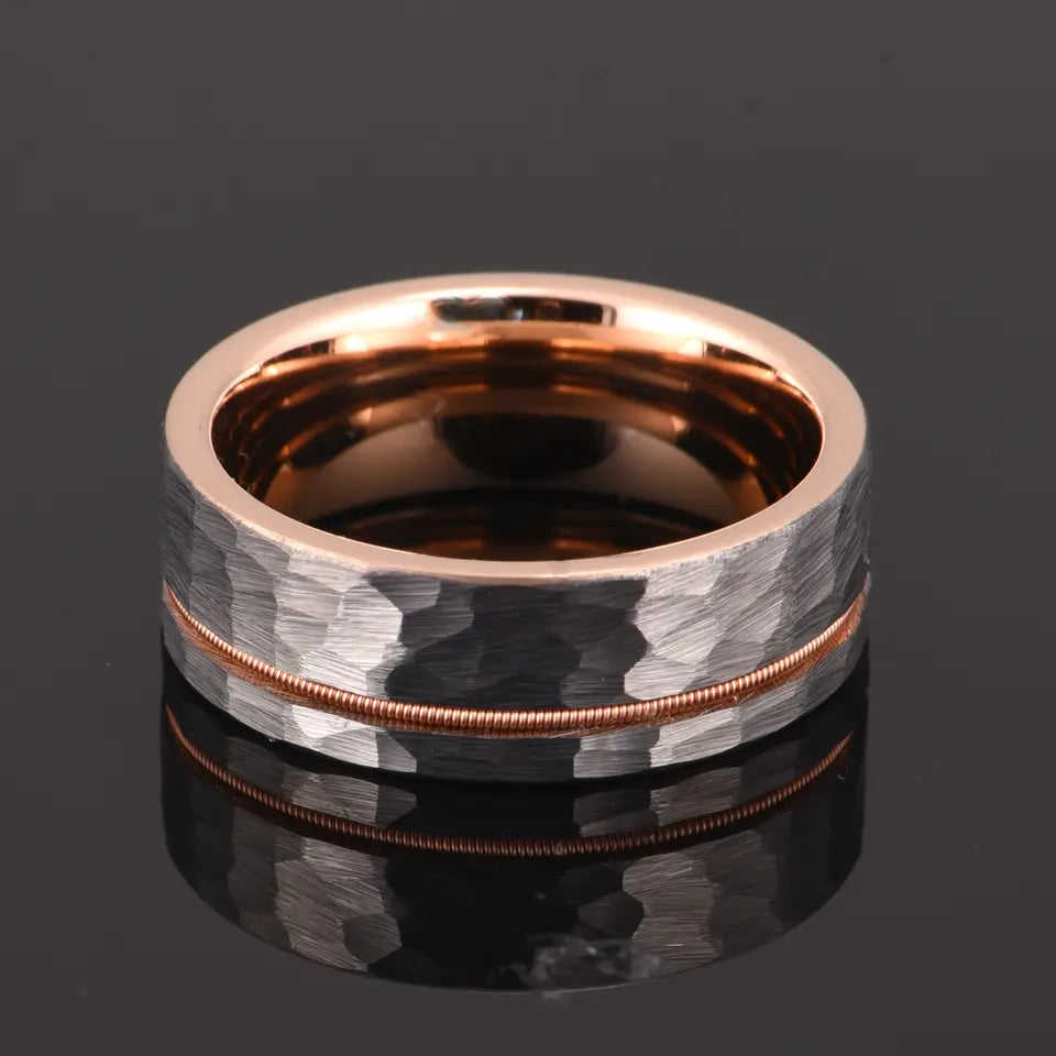 Flat gold and silver hammered wedding band by Forge and Lumber, available in sizes UK M, N, O.